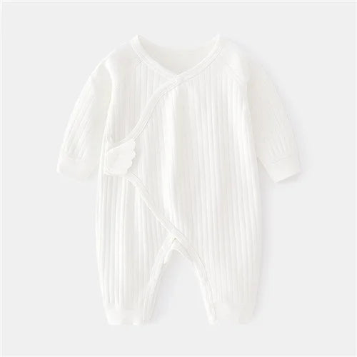 Grenouillère Coton Bébé - Floral Confort unisexe blanche à manches longues, tissu côtelé doux 100% coton pour nouveau-né. Idéale pour le printemps.